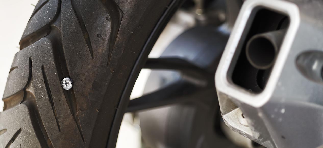 repair a motorcycle tyre puncture
